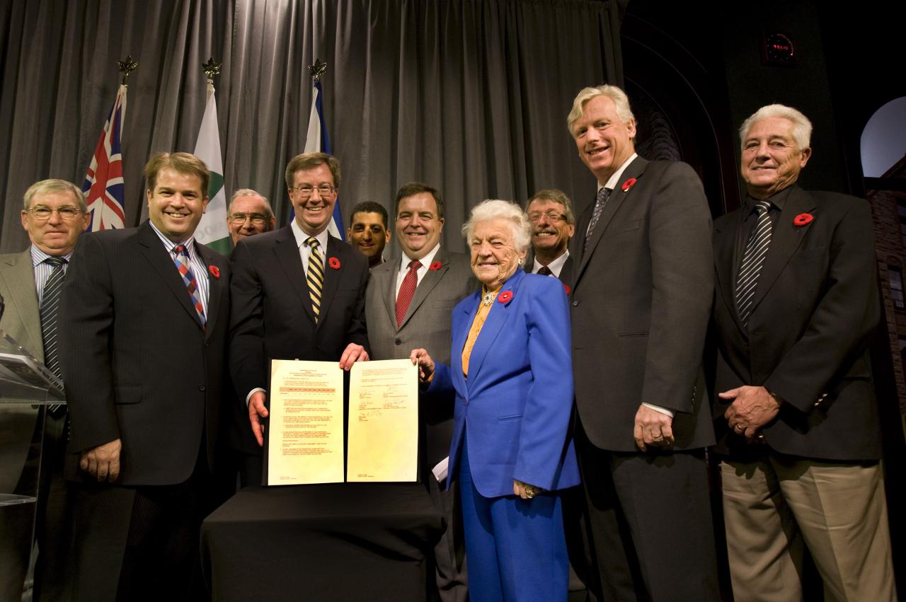 Image of the Upload Agreement signing in 2008