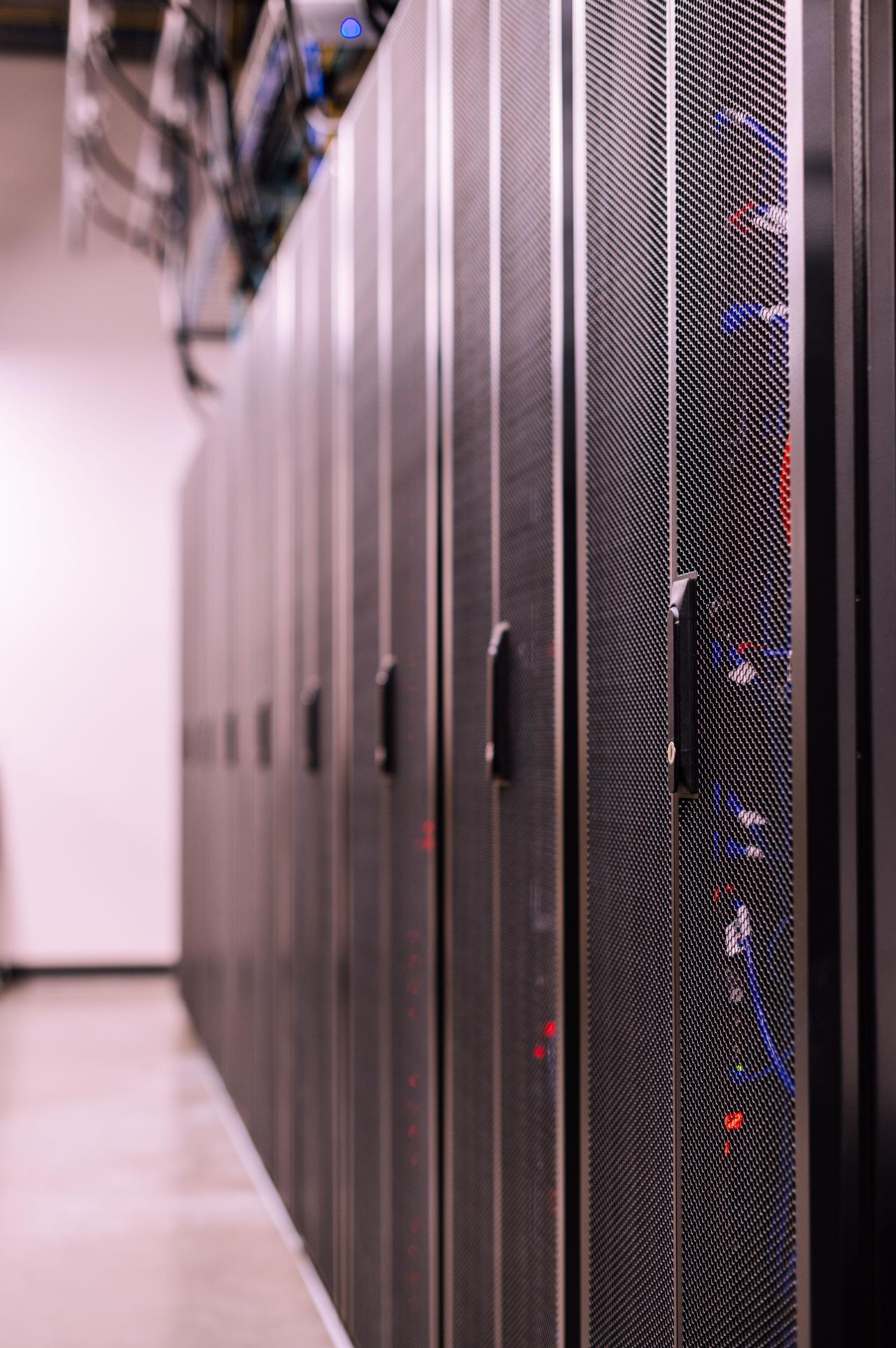 Detailed view of network server racks in a modern data center, highlighting technology infrastructure. Image on Pexels courtesy of Brent Sayles