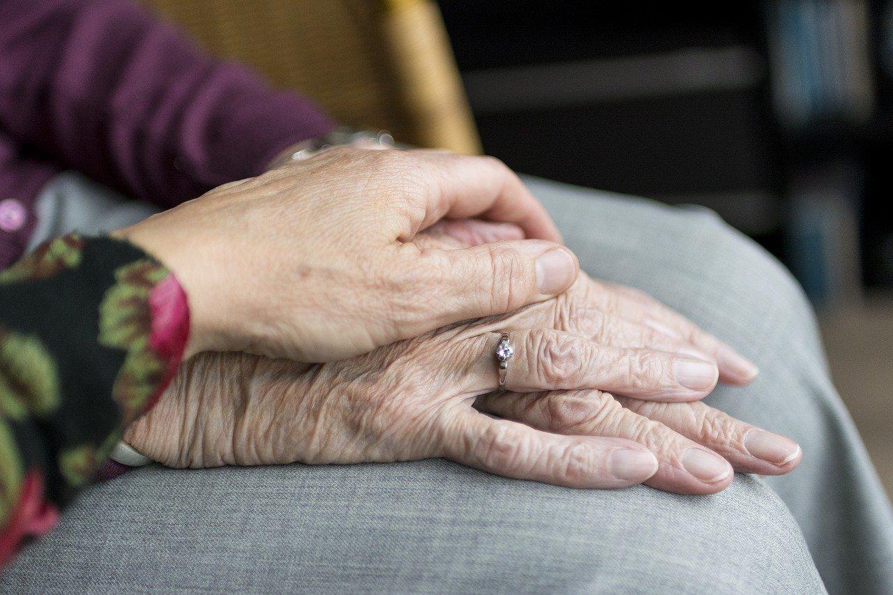 image of someone's hand over another person's hand