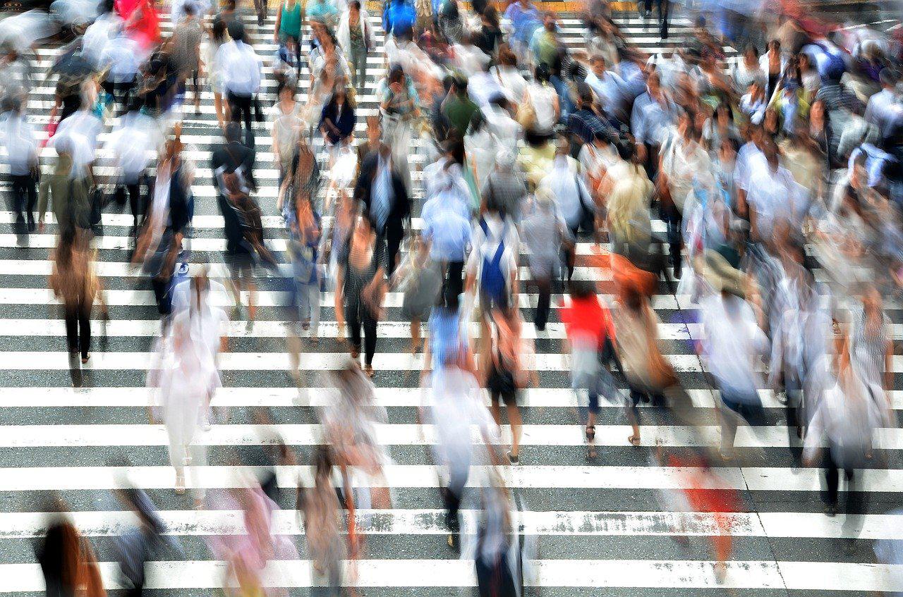 image of people at busy street crossing