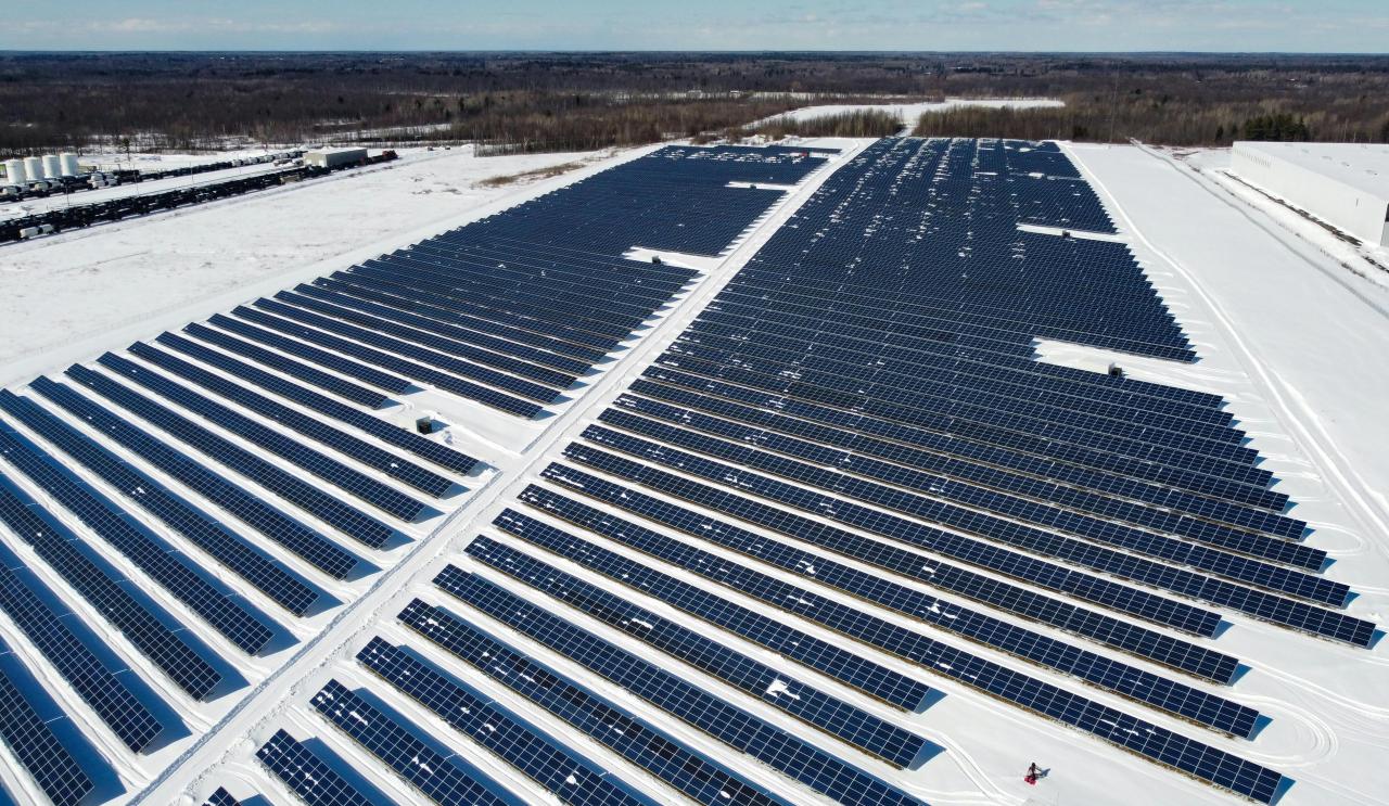 Photo of Solar Panels on a snow-covered ground courtesy of Braeson Holland
