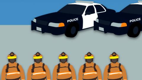 Image of police cars and firefighters