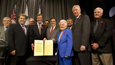 Image of the Upload Agreement signing in 2008
