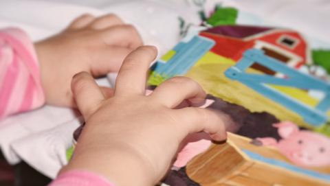 Image of child's hand from Pixabay
