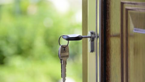 image of a key in a door