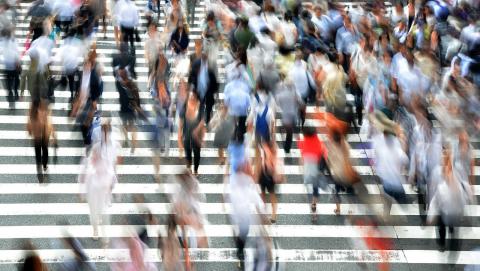 image of people at busy street crossing