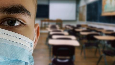 Image of masked person in classroom by Alexandra_Koch from Pixabay 