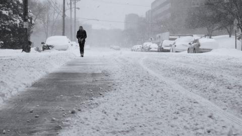 Picture of a man walking through snow