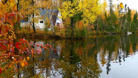 Image of fall cottage on water courtesy of Pixabay