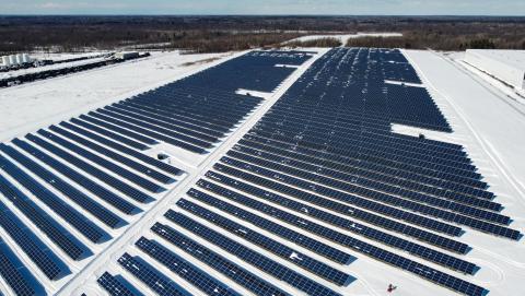Photo of Solar Panels on a snow-covered ground courtesy of Braeson Holland